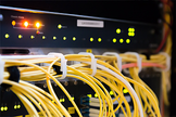 Close-up of neatly routed network patch cables inside a data centre rack