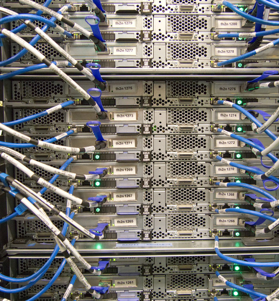 Densely racked cache server nodes, each labelled and wired with blue network patch cables